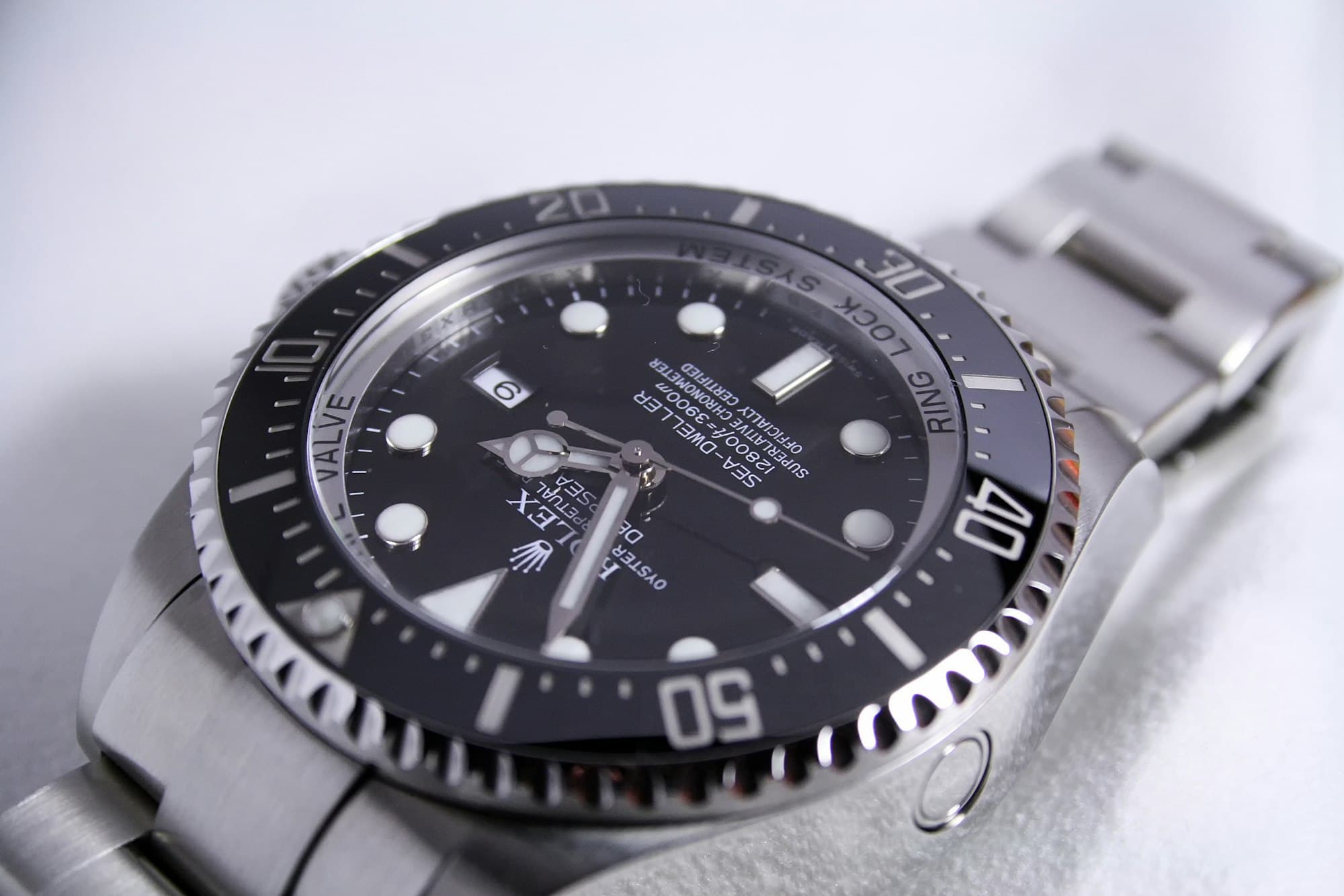 Rolex Sea-Dweller with black dial on a white surface